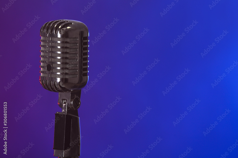 Fototapeta premium Retro microphone on dark color background