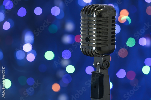 Retro microphone against defocused lights