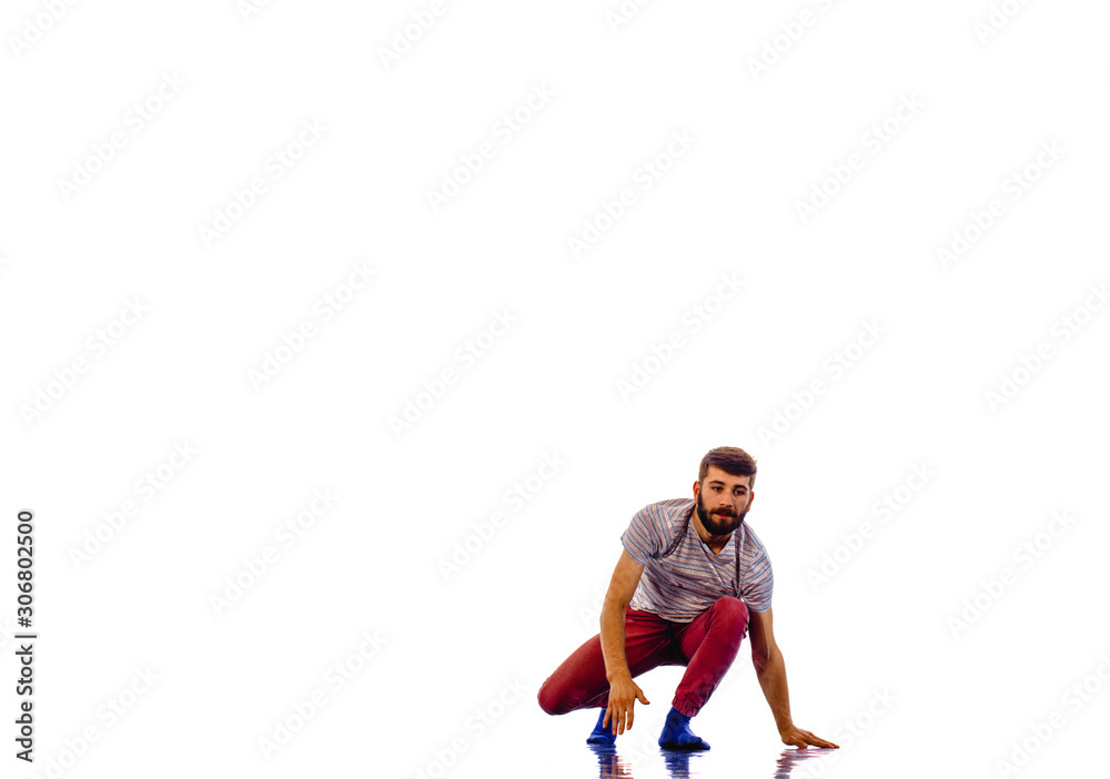 Man is dancing in the studio on a white background