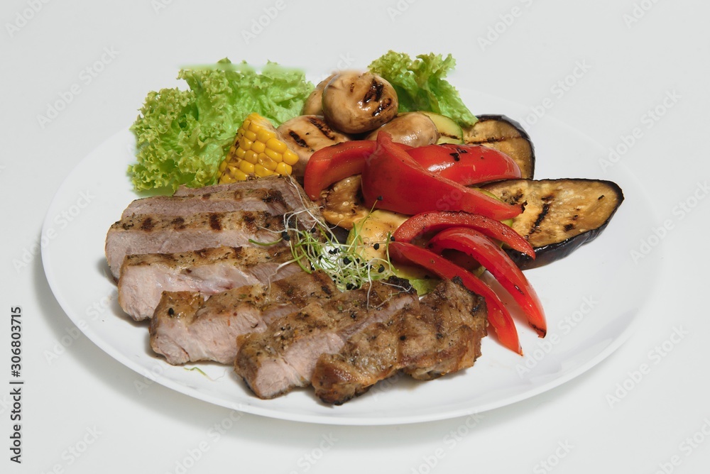 BBQ Steak. Barbecue Grilled Beef Steak Meat with Vegetables. Healthy Food. Barbeque Steak Dinner BBQ Steak. Barbecue Grilled Beef Steak Meat with Vegetables. Healthy Food. Barbeque Steak Dinner