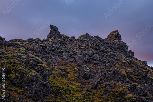 Iceland in september 2019. Great Valley Park Landmannalaugar  surrounded by mountains of rhyolite and unmelted snow. In the valley built large camp. Evening in september 2019
