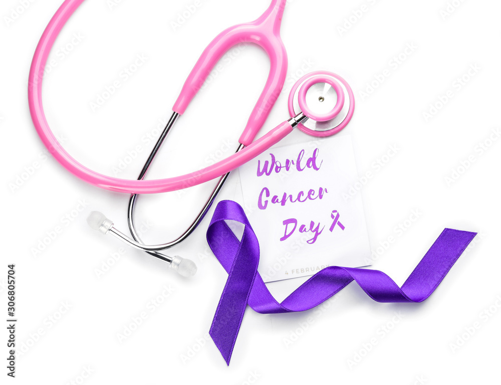 Paper with text WORLD CANCER DAY, stethoscope and purple ribbon on white background