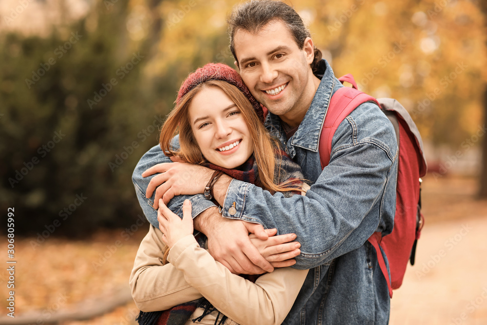 Fototapeta premium Happy couple walking in autumn park