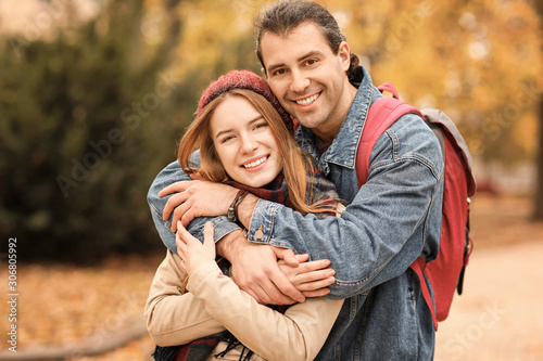 Happy couple walking in autumn park © Pixel-Shot