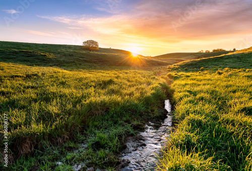 stream running through the field during the summer