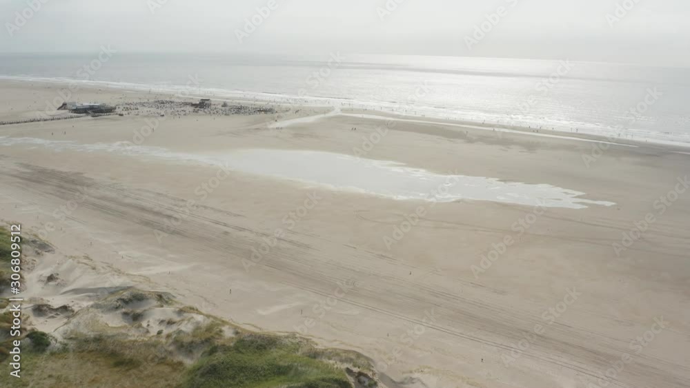 custom made wallpaper toronto digitalCinematic drone / aerial shot of the sandy beach with tourists and people in St. Peter Ording at the north sea, schleswig holstein, germany, 30p
