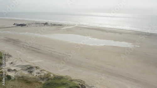 Wallpaper Mural Cinematic drone / aerial shot of the sandy beach with tourists and people in St. Peter Ording at the north sea, schleswig holstein, germany, 30p Torontodigital.ca
