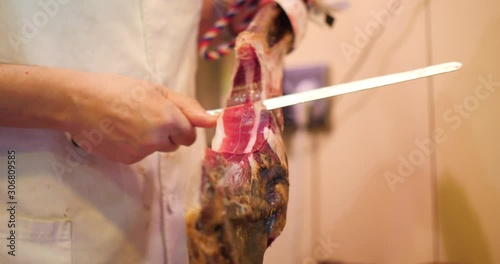 slicing Jamon, Pata Negra in a market, Mercado, Spanish Ham