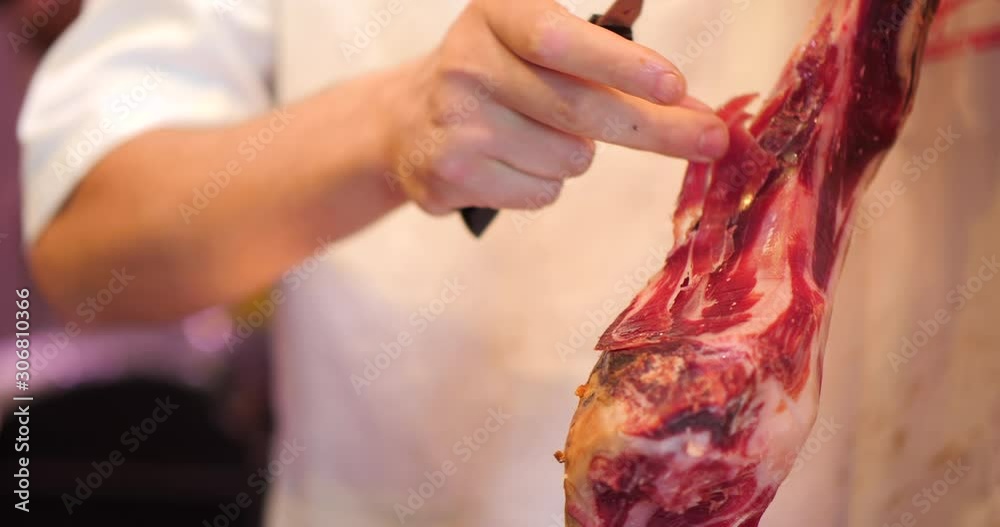 slicing Jamon, Pata Negra in a market, Mercado, Spanish Ham