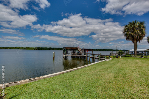 Wallpaper Mural Grassy meadow next to the lake boat dock Torontodigital.ca