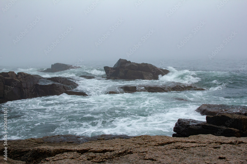 Rough Seas with Waves and Rocks Surrounded by Mist