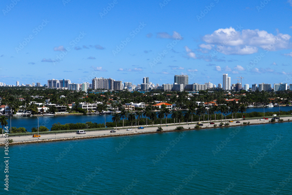 The MacArthur Causeway with Palm Island and South Beach buildings in the background in Miami, Florida.