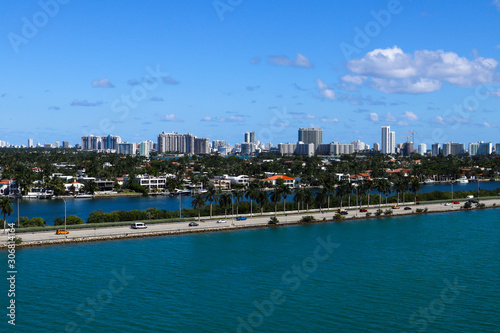 The MacArthur Causeway with Palm Island and South Beach buildings in the background in Miami  Florida.