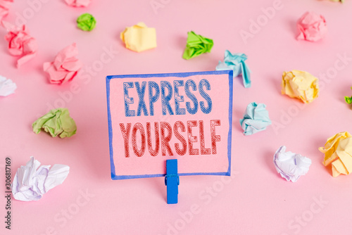 Word writing text Express Yourself. Business photo showcasing to communicate or reveal one s is thoughts or feelings Colored crumpled papers empty reminder pink floor background clothespin © Artur