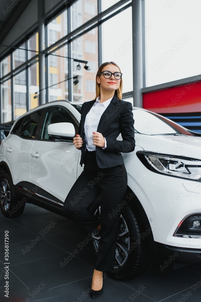business woman buys a car at a car dealership business woman buys a car at a car dealership