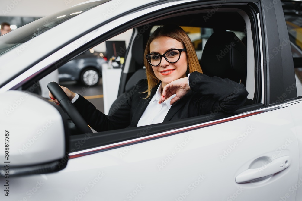 Young business woman driving in her car to work. Successful business concept. business woman driving