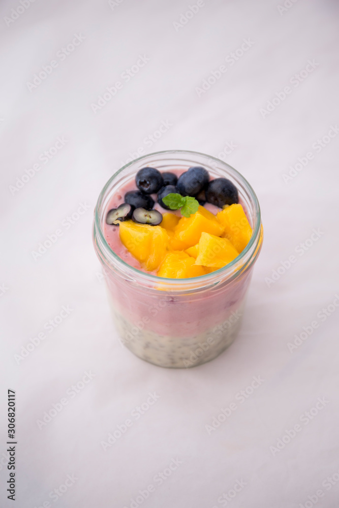 Chia pudding and acai smoothie with blueberries and mango Chia pudding and acai smoothie with blueberries and mango