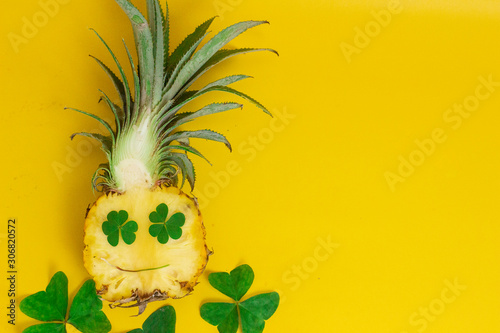 exotic tropical fruits, pineappleisolated on a yellow background photo