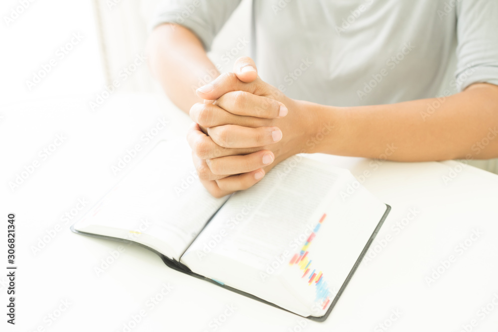 woman hands praying to god with the bible. begging for forgiveness and believe in goodness. woman hands praying to god with the bible. begging for forgiveness and believe in goodness.