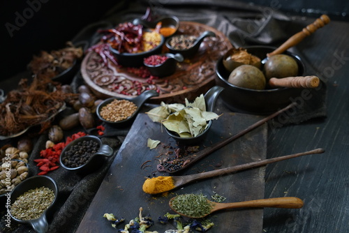 A variety spices and herbs in wooden bowls, Of Asians For cooking.