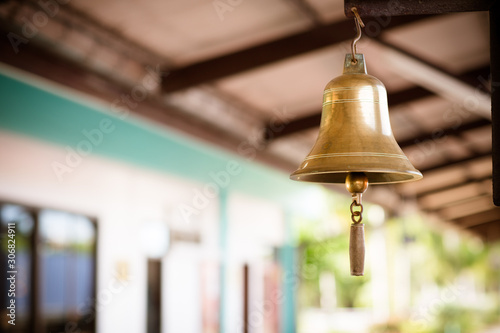 Golden bell at train station platform. Vintage transportation. Sign of traveling and jouney of slow life, concept. soft and blur style.