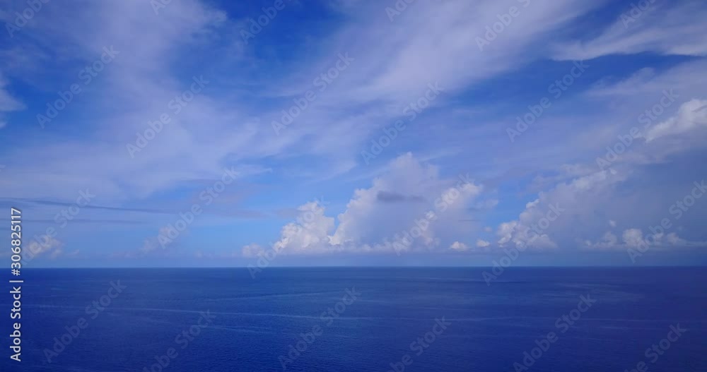 custom made wallpaper toronto digitalPeaceful heaven with frozen veil of clouds hanging over deep blue ocean at sunrise in Dominican Republic, copy space