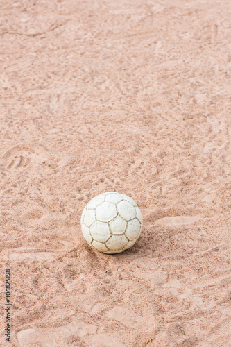 Vintage Soccer ball on sand