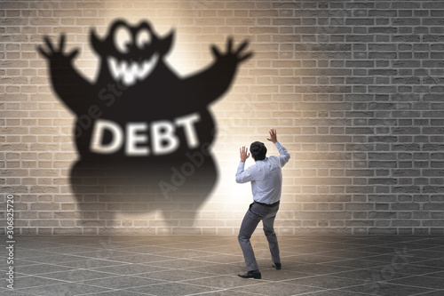Obraz na plátne Businessman in debt and loan concept