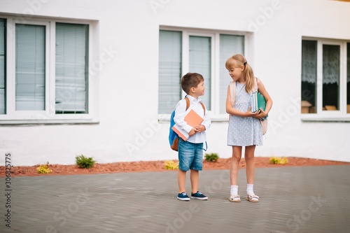 Two little friends go to school. Schoolchildren. back to school