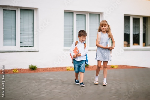 Two little friends go to school. Schoolchildren. back to school