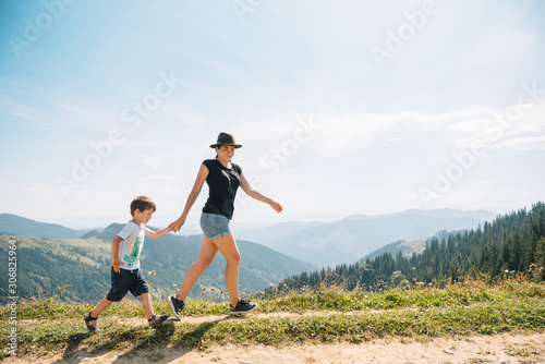 mother and son having rest on vacation in mountains