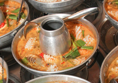 Tom Yum Seafood, shrimp, shell, fish and crab recommend Thai local food for traveler and tourist. Spicy and soul soup. image for background, copy space. objects and menu list.