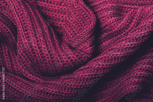 Knitted violet scarf texture. The concept of cozy, comfort, warm, softness or winter