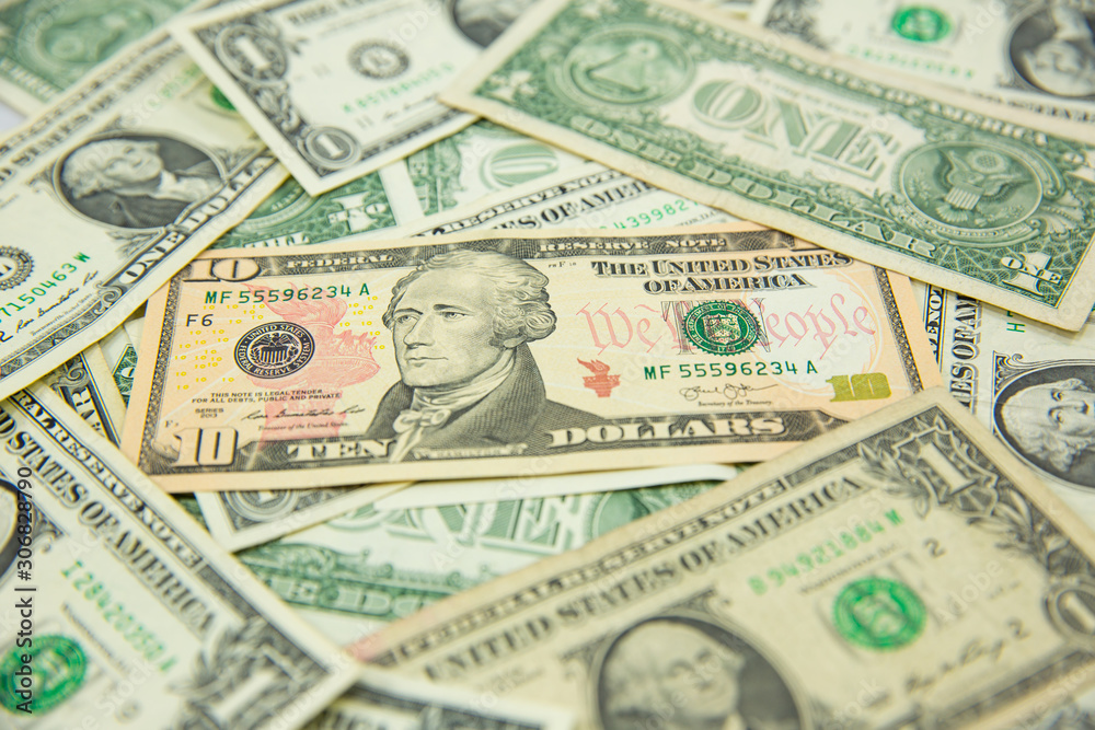 Money american hundred dollar bills Pile of various currencies isolated on white background.Closeup of assorted American banknotes.US currency scattered on the table.america currency dollor currency. Money american hundred dollar bills Pile of various currencies isolated on white background.Closeup of assorted American banknotes.US currency scattered on the table.america currency dollor currency.