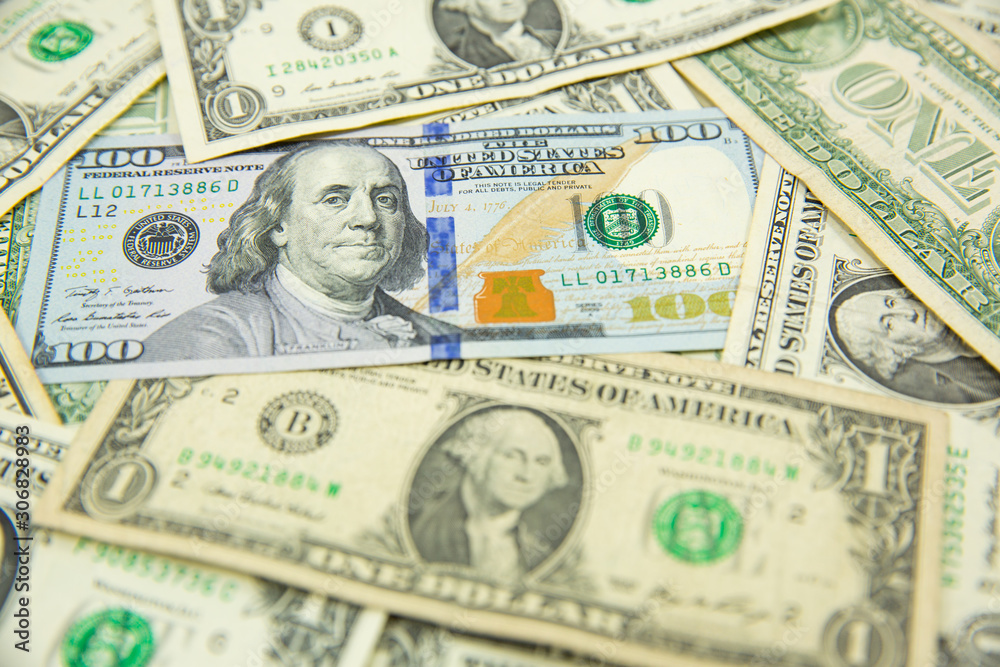 Money american hundred dollar bills Pile of various currencies isolated on white background.Closeup of assorted American banknotes.US currency scattered on the table.america currency dollor currency. Money american hundred dollar bills Pile of various currencies isolated on white background.Closeup of assorted American banknotes.US currency scattered on the table.america currency dollor currency.
