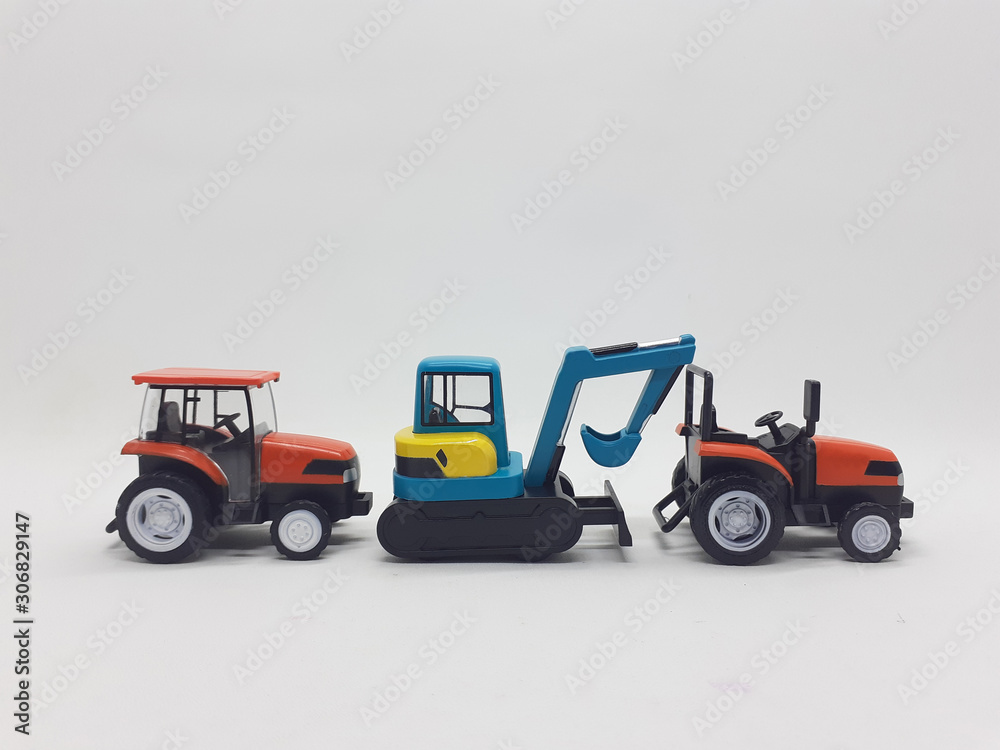 Fototapeta premium Photo Realistic Heavy Machinery Tractor Excavator Miniature Die Cast Toys Design for Souvenir Gift Collection Items in White Isolated Background 