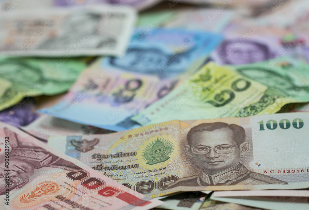 Thai money - Baht. Pile of various currencies isolated on white background. Thai baht banknote coin isolated on white background. Many of Thai Baht background. Thai currency. Thai money - Baht. Pile of various currencies isolated on white background. Thai baht banknote coin isolated on white background. Many of Thai Baht background. Thai currency.