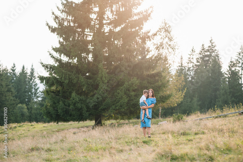 mother and son having rest on vacation in mountains