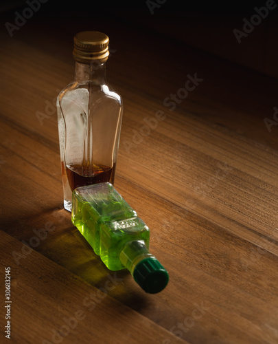 Whiskey bottle isolated on black background.