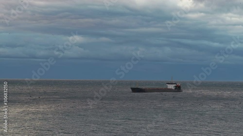 Large container ship at sea. Oil tanker at dusk.