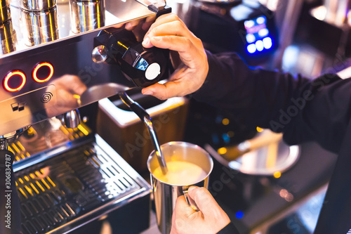 barista hands make coffee by coffee matchine. photo