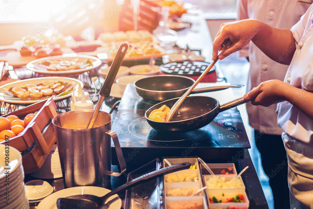 the chef cooking food  in saucepan