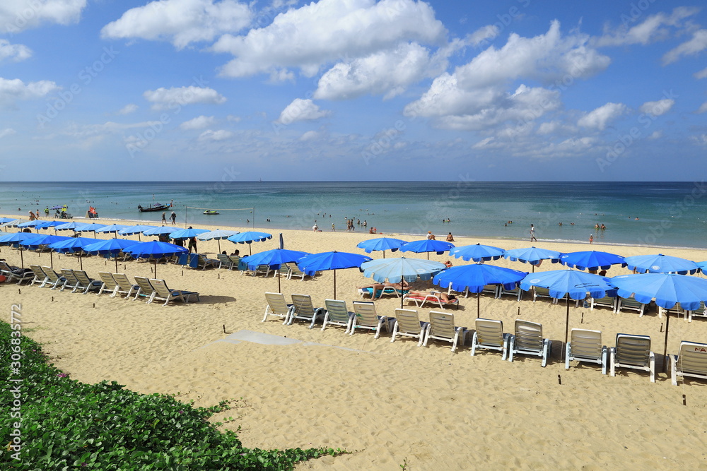 beach with chairs and umbrellas