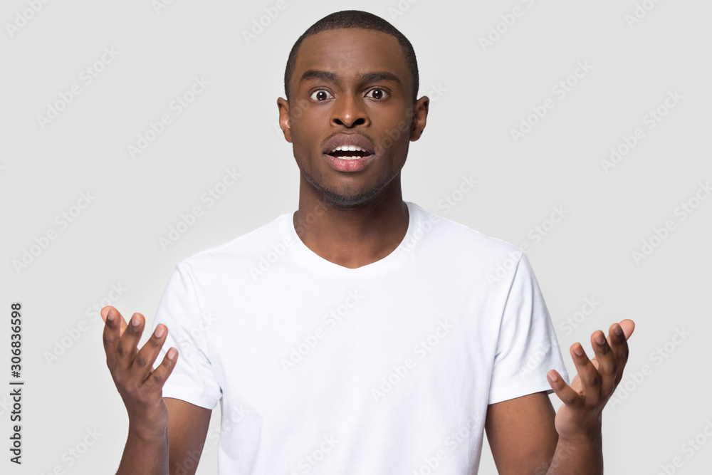 Outraged unsatisfied African American man hearing bad news Outraged unsatisfied African American man hearing bad news