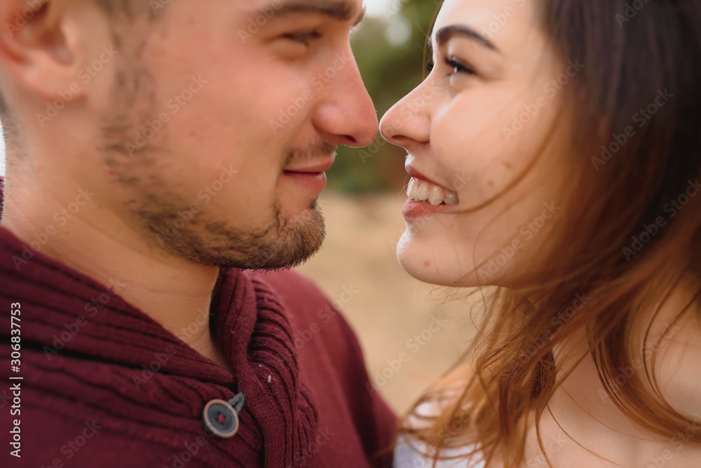 low contrast image of a happy romantic young couple spending time outdoor in the autumn park low contrast image of a happy romantic young couple spending time outdoor in the autumn park
