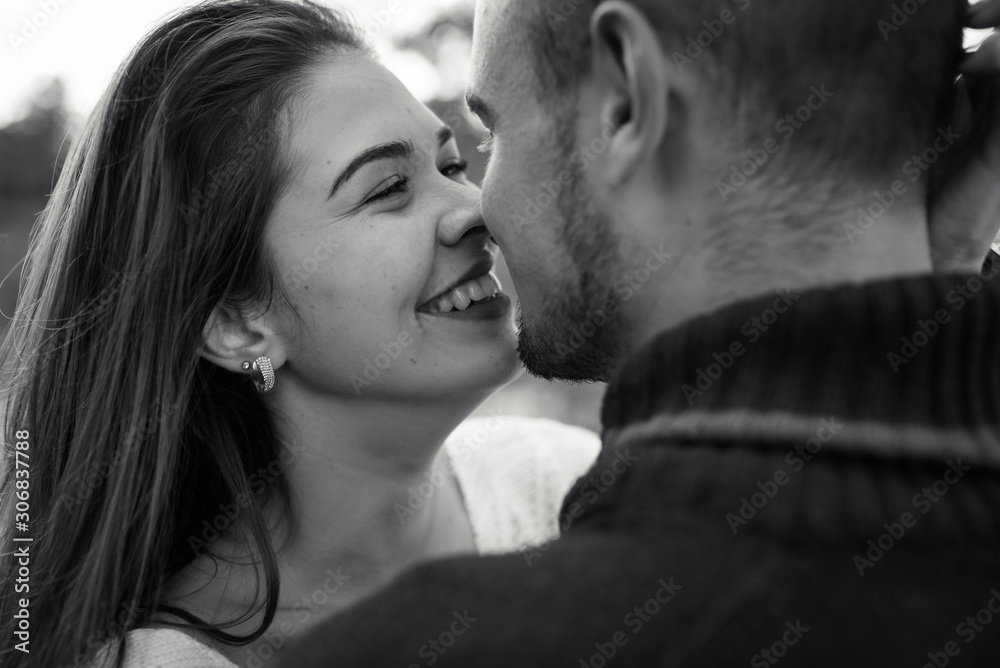 low contrast image of a happy romantic young couple spending time outdoor in the autumn park low contrast image of a happy romantic young couple spending time outdoor in the autumn park