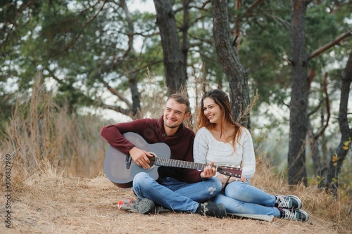 Portrait of happy couple in love dating outdoors at the park. Valentine day. Happy relationship
