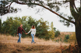 Portrait of happy couple in love dating outdoors at the park. Valentine day. Happy relationship