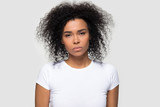 Dissatisfied African American woman looking at camera, negative attitude
