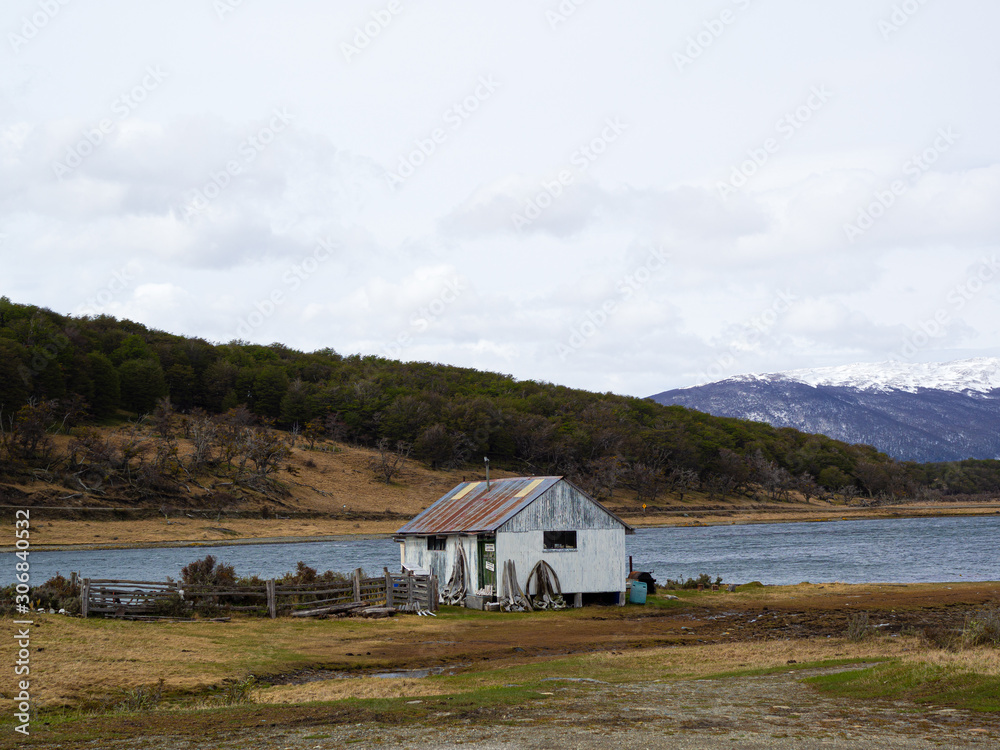 small wooden house on the shore of Beagle Channel
